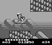 une photo d'Ã©cran de Adventure Island 2 - Aliens in Paradise sur Nintendo Game Boy